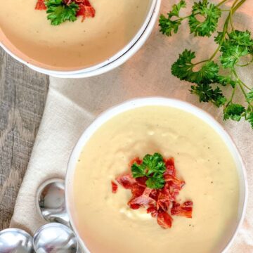 Cauliflower "Cheese" Soup 2 Ways in two bowls