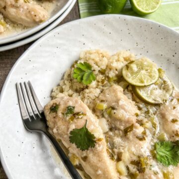 Creamy Coconut Lime Chicken in white round bowl with fork