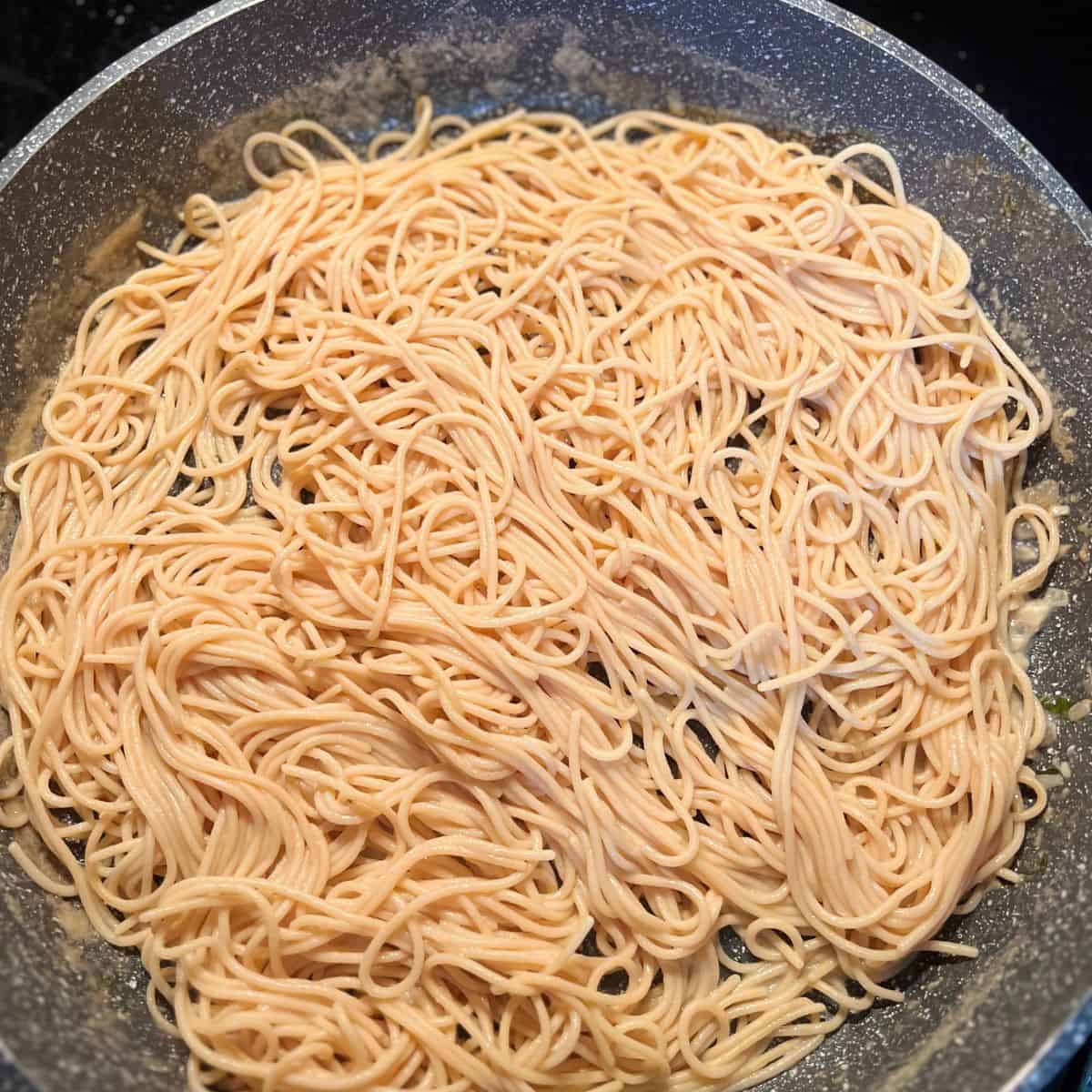 Cooked pasta ready to soak up the sauce from the garlic chicken meatballs.